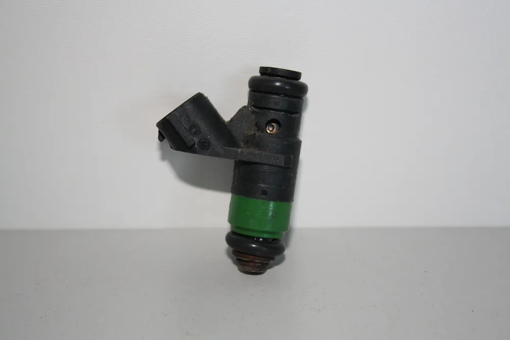Novinka Vstřikovací ventil 03E906031 pro 1.2 12v HTP - použitý